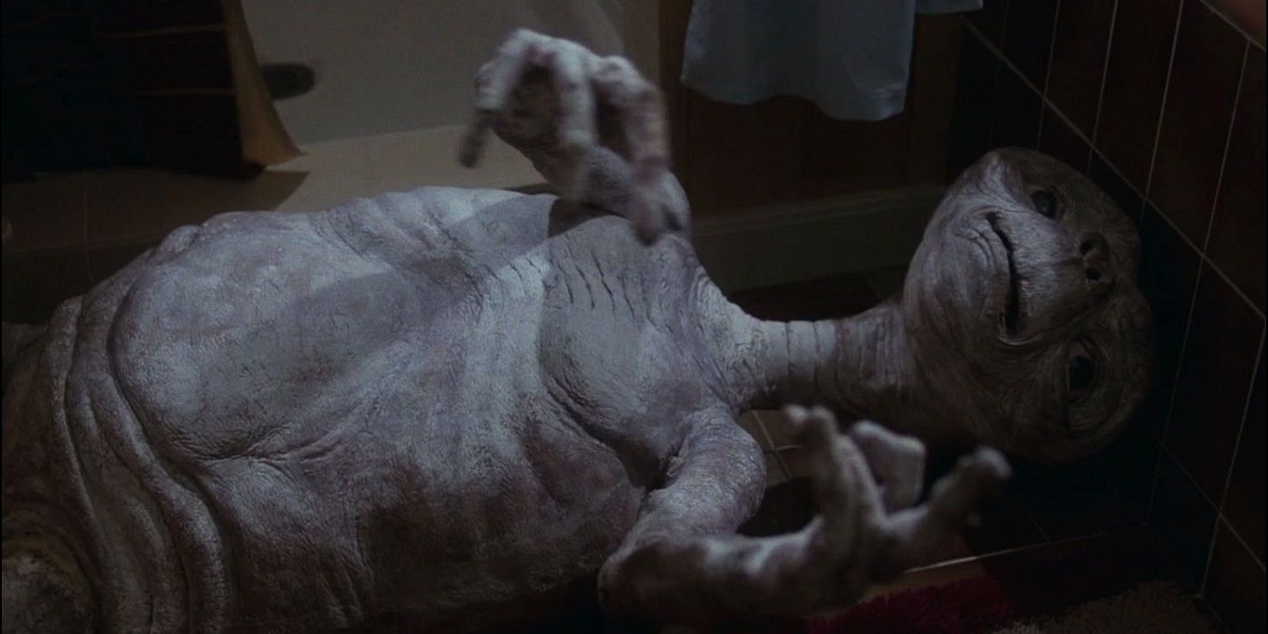ET on the floor dying