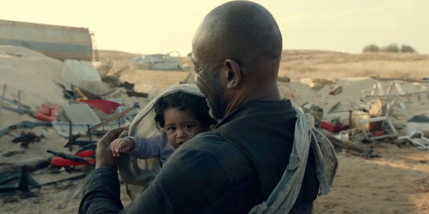Baby Mo in a carrier being held by Morgan in Fear the Walking Dead.