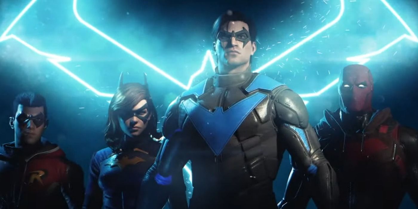 The four playable protagonists of Gotham Knights standing in front of a glowing blue Bat symbol