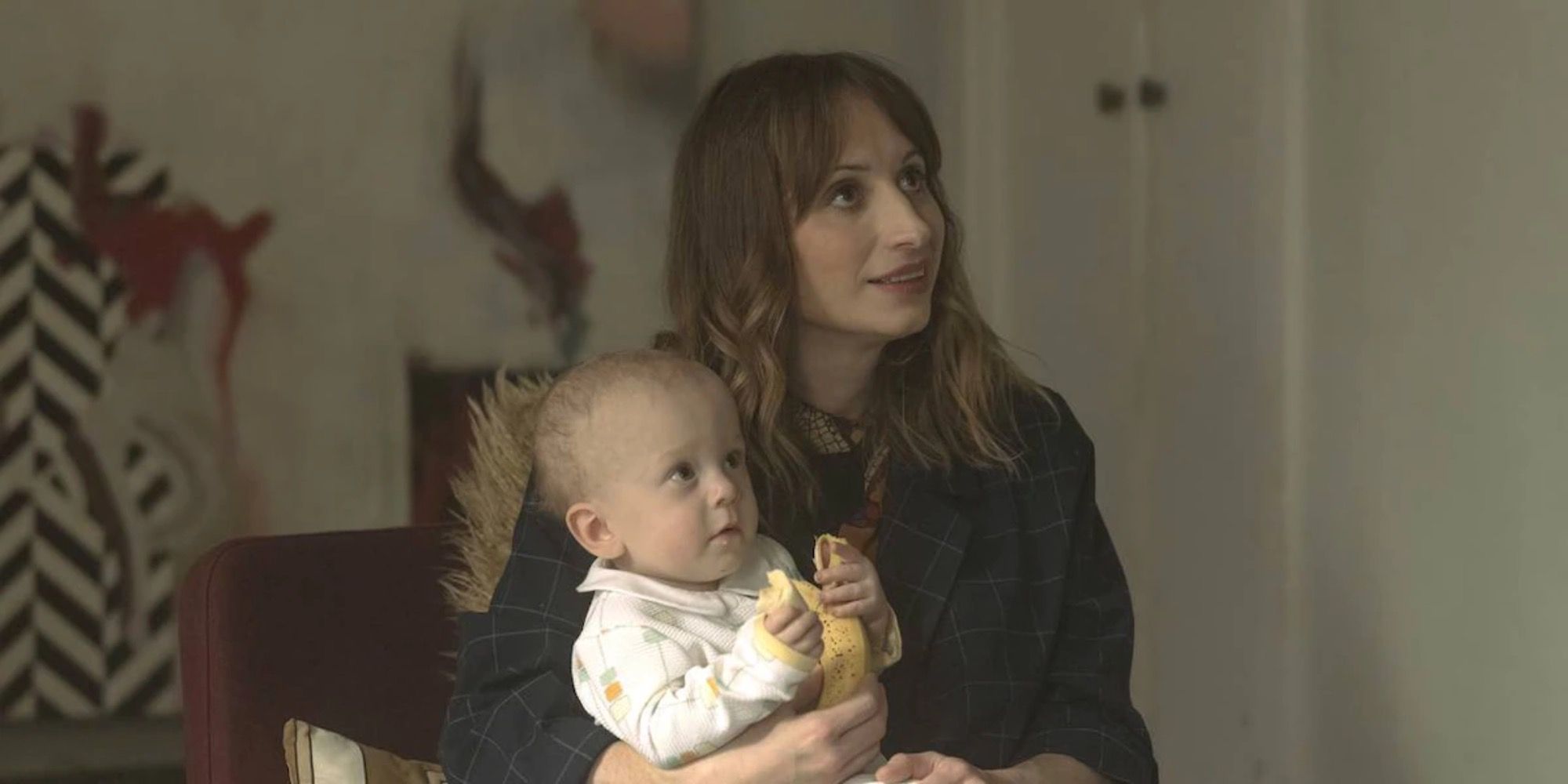 Image of Tash’s friend holding the mysterious baby