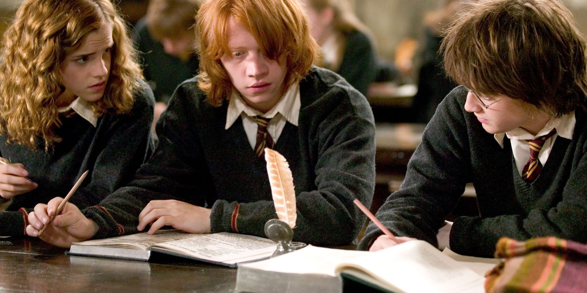 Harry, Ron, and Hermione studying in Harry Potter