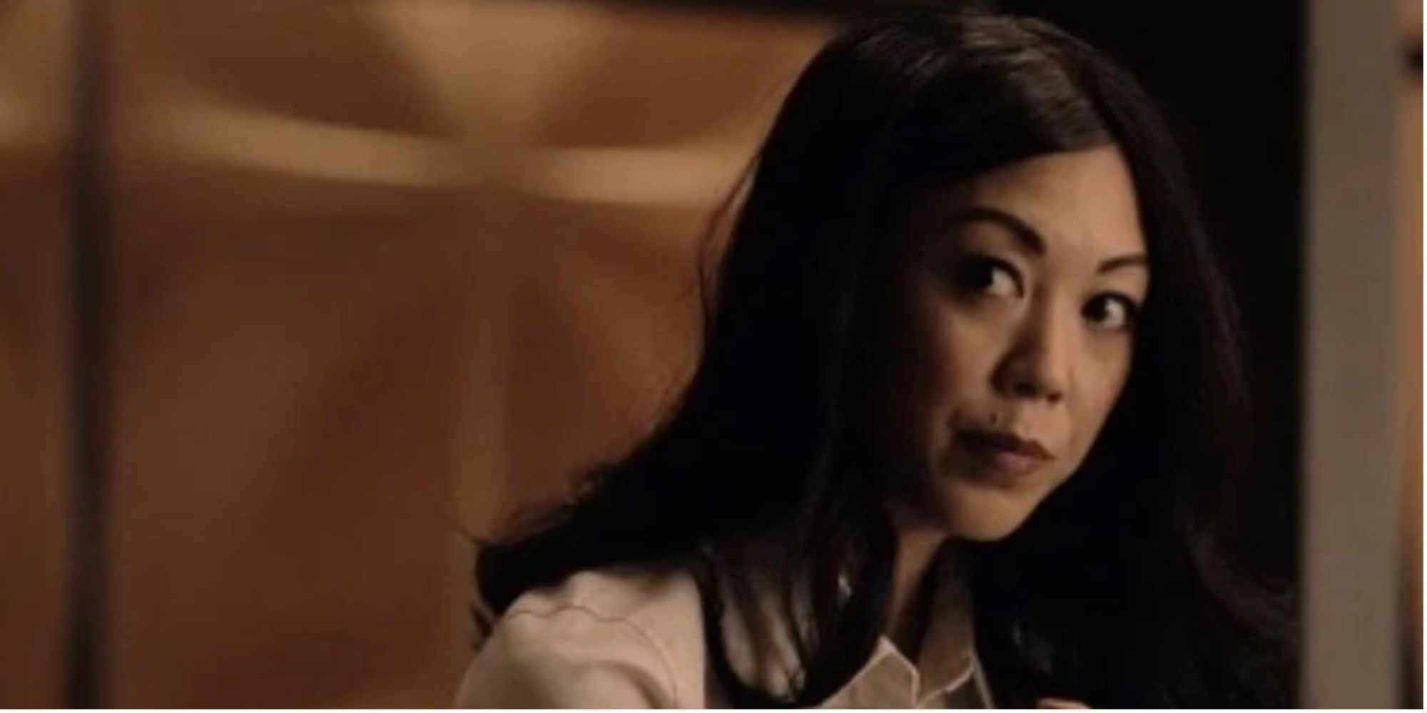 Image of Brittany Ishibashi as Claire Cormier looking into the distance on Tom Swift