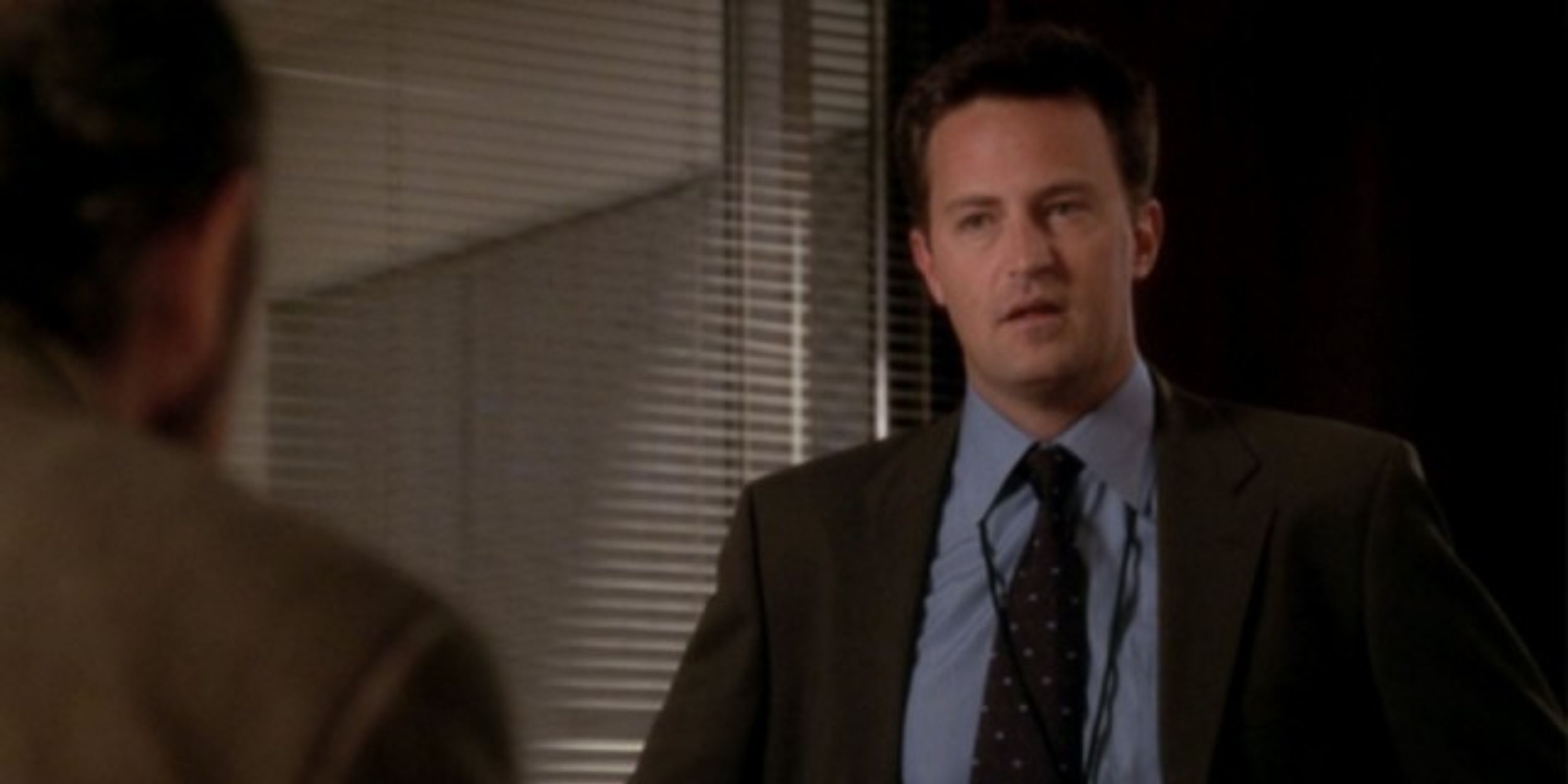 Joe Quincy looking at someone in The West Wing.