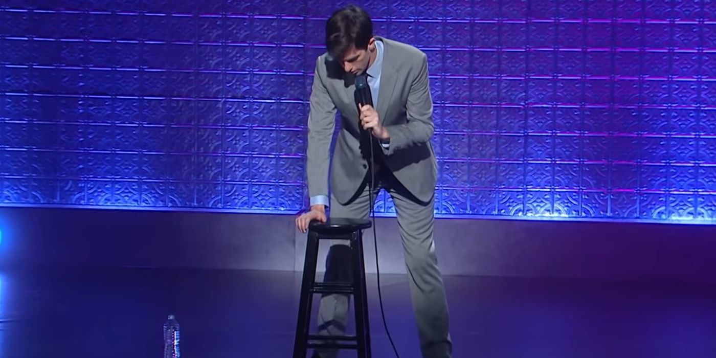 John Mulaney demonstrates the time he got a prostate exam using a stool on stage