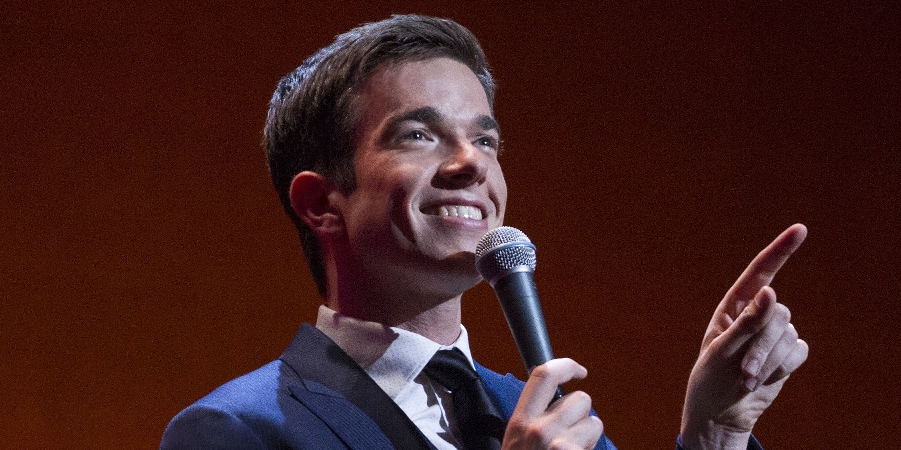 John Mulaney smiling and pointing in the Comeback Kid