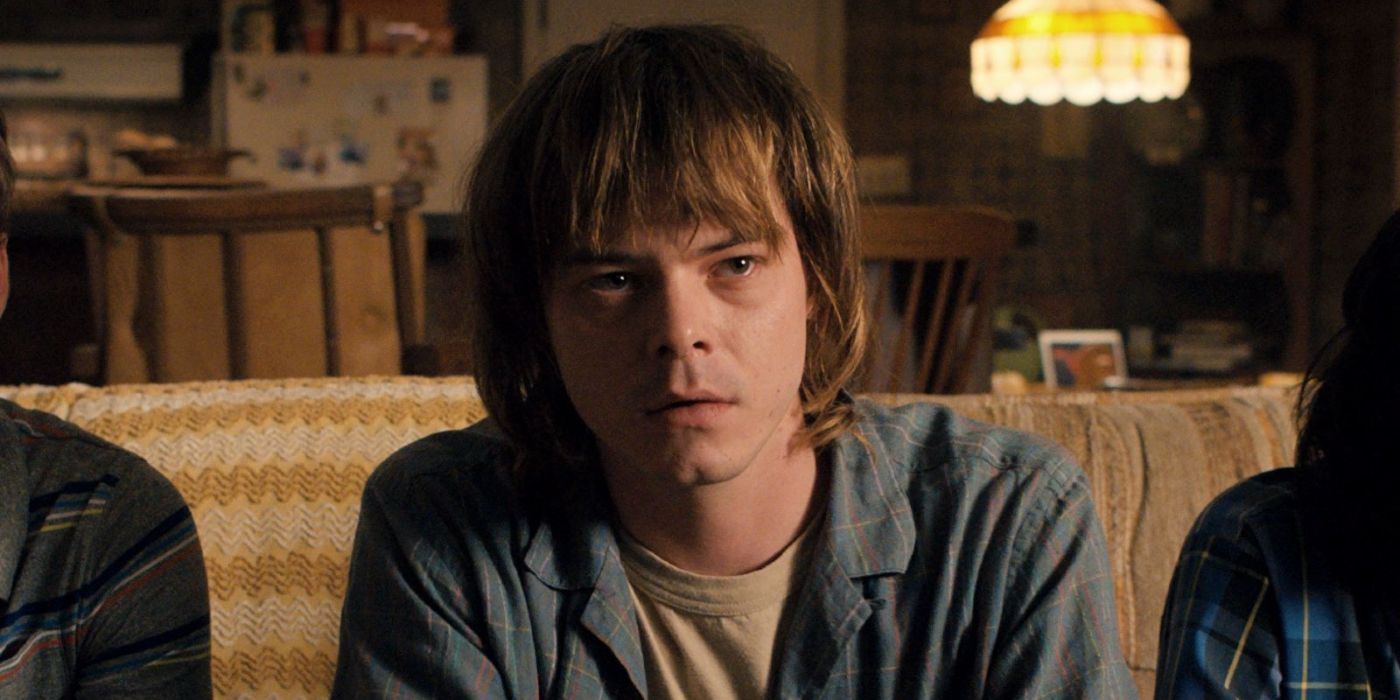Jonathan Byers on the couch looking concerned