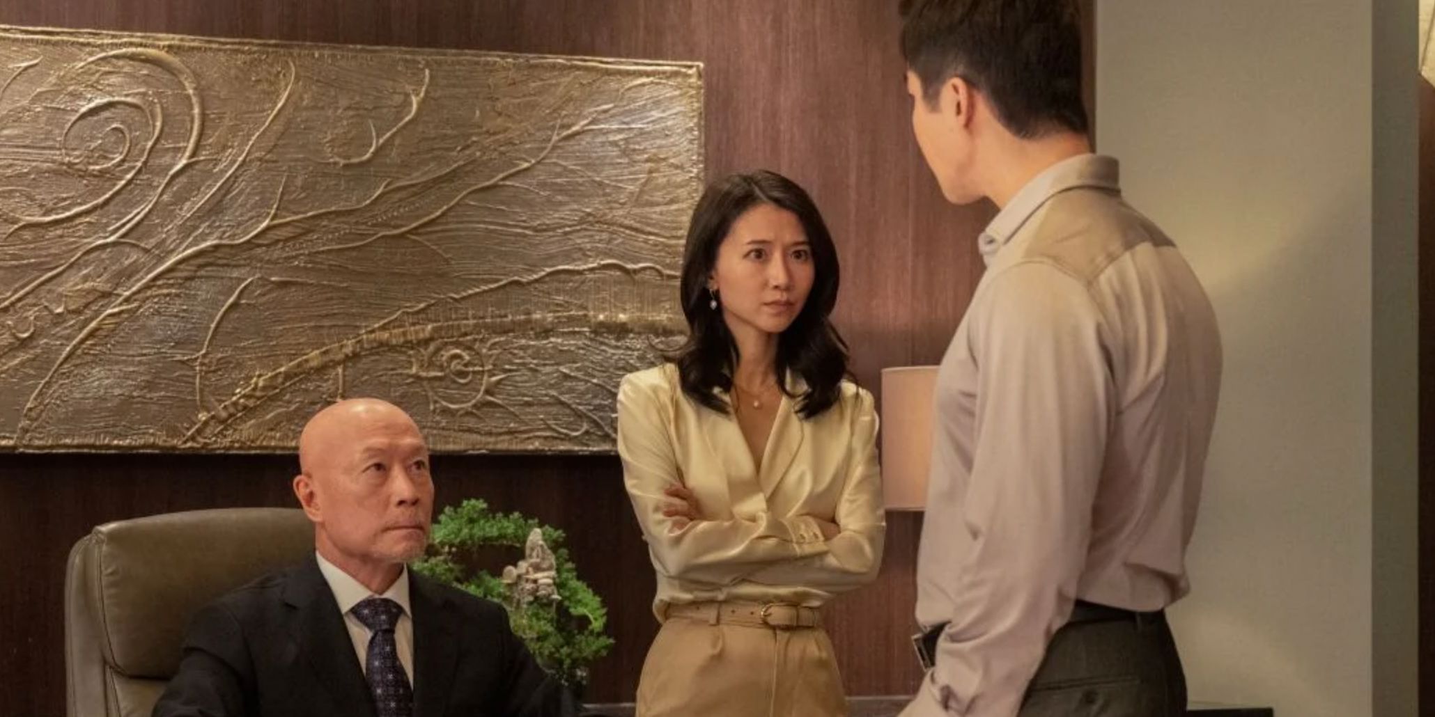 Juliette stand next to her father while her brother speaks in Kung Fu