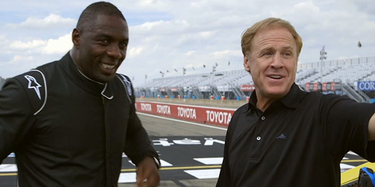 Idris Elba speaks to a NASCAR driver from King of Speed 