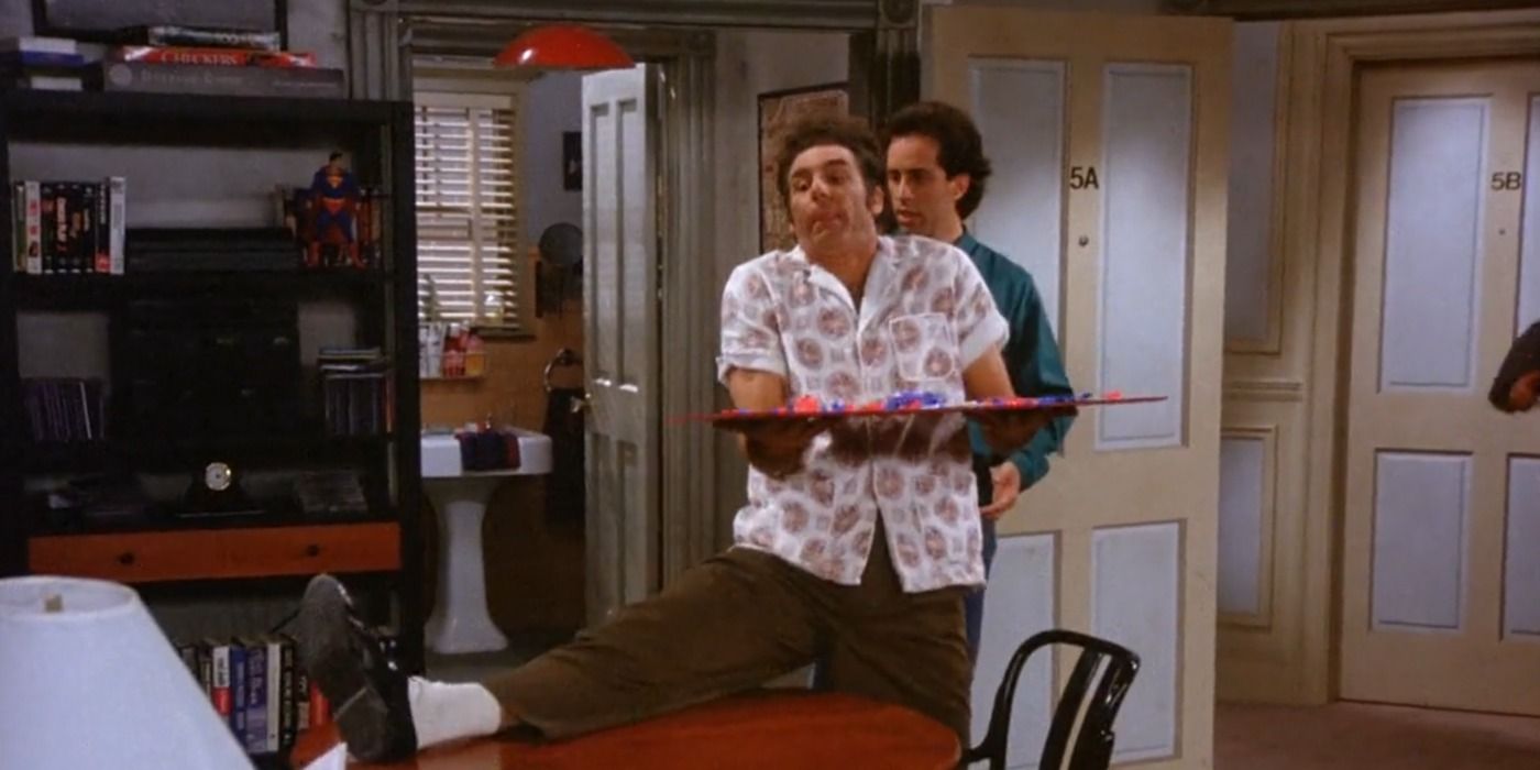 Kramer enters Jerry's apartment with a board game in Seinfeld