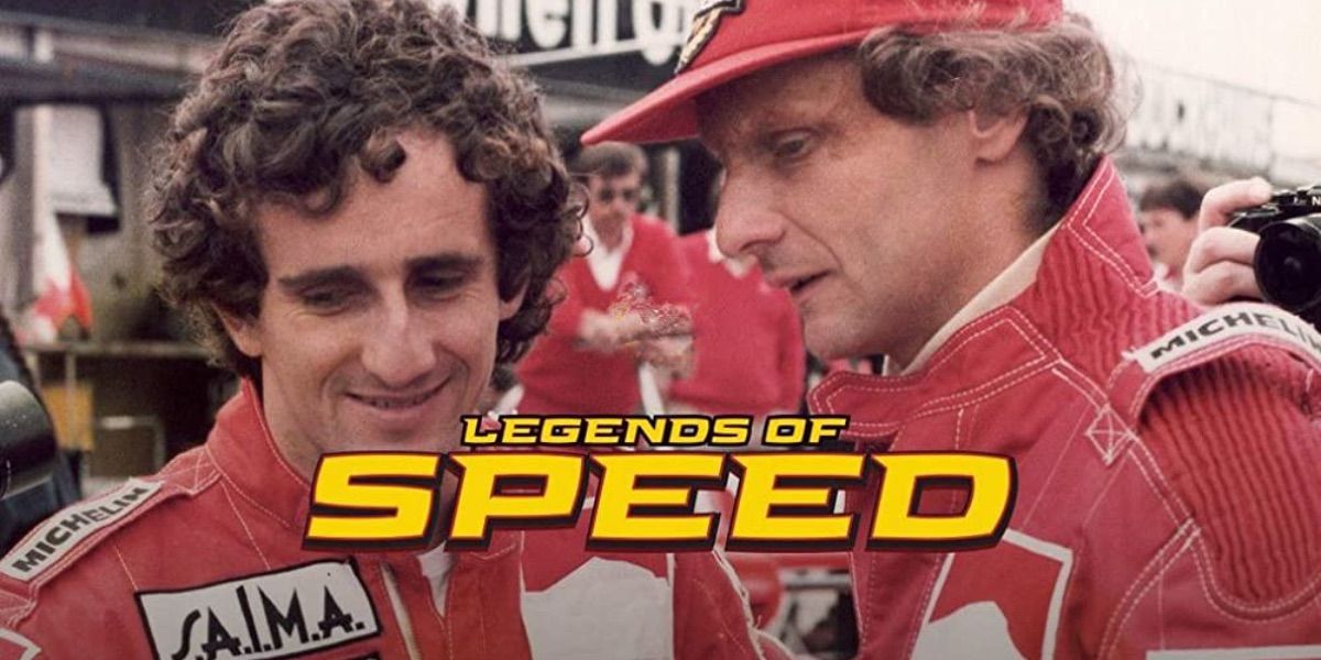 Two men in racing gear speak from Legends of Speed
