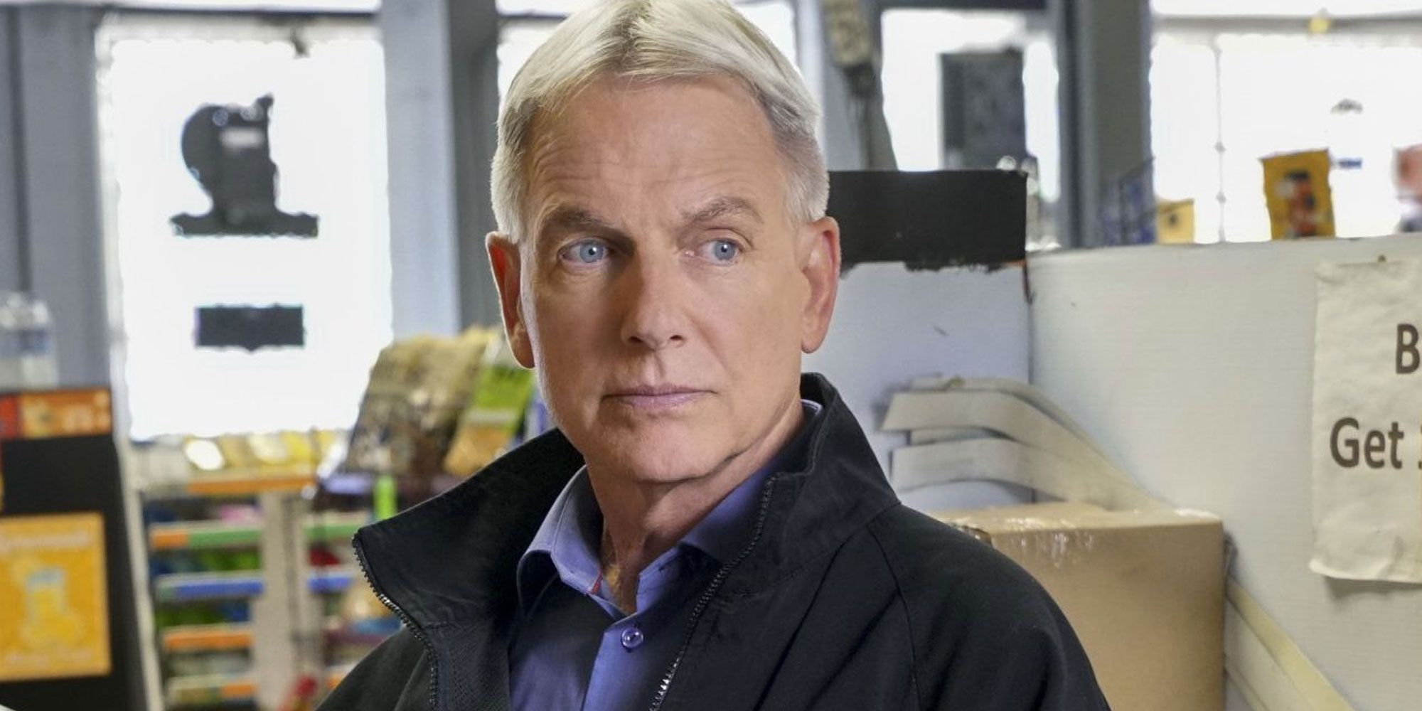Leroy Jethro Gibbs looks serious in a convenience store in NCIS.