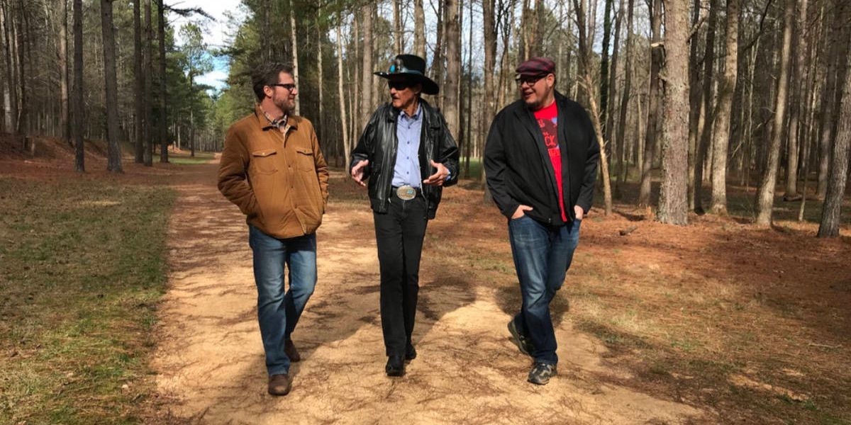 Dale Earnhardt Jr. speaks with Richard Petty and Mathew Dilner as they explore an abandoned racetrack in Lost Speedways 