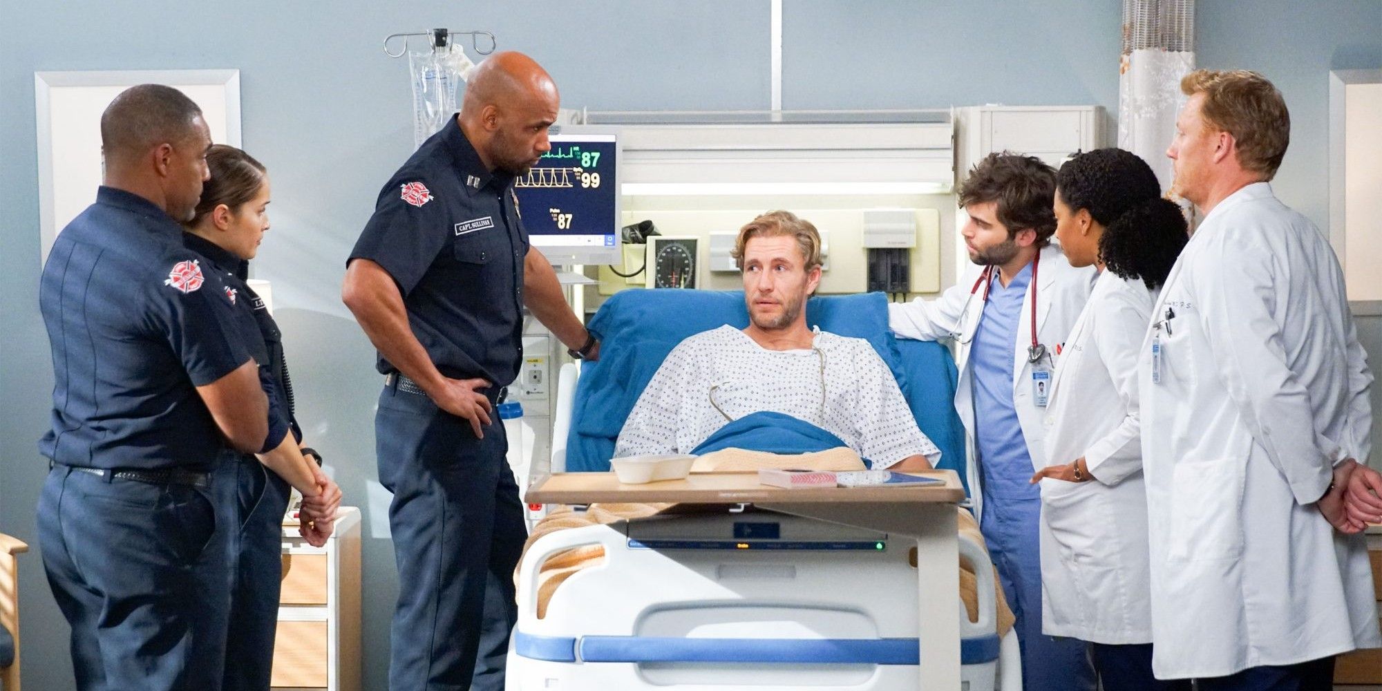 Lucas Ripley lying in a hospital bed surrounding by Station 19
