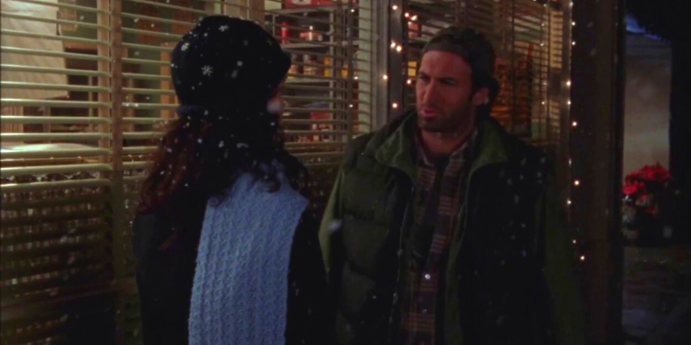 Luke and Lorelai talk outside in the snow on Gilmore Girls