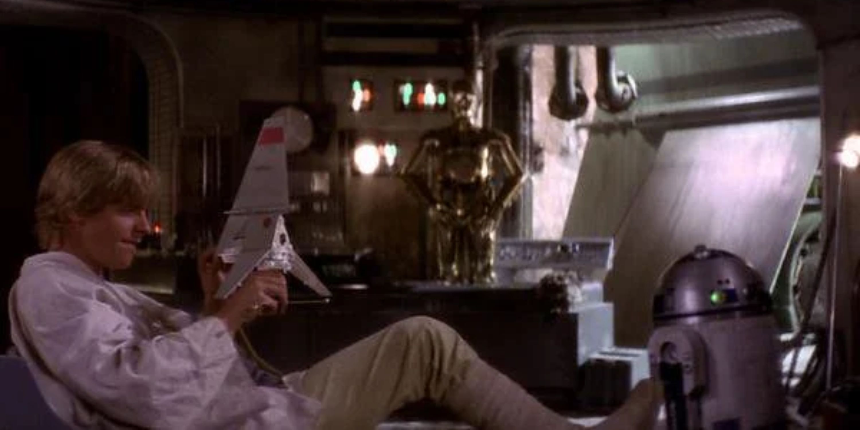 Luke plays with a toy T-16 in Star Wars