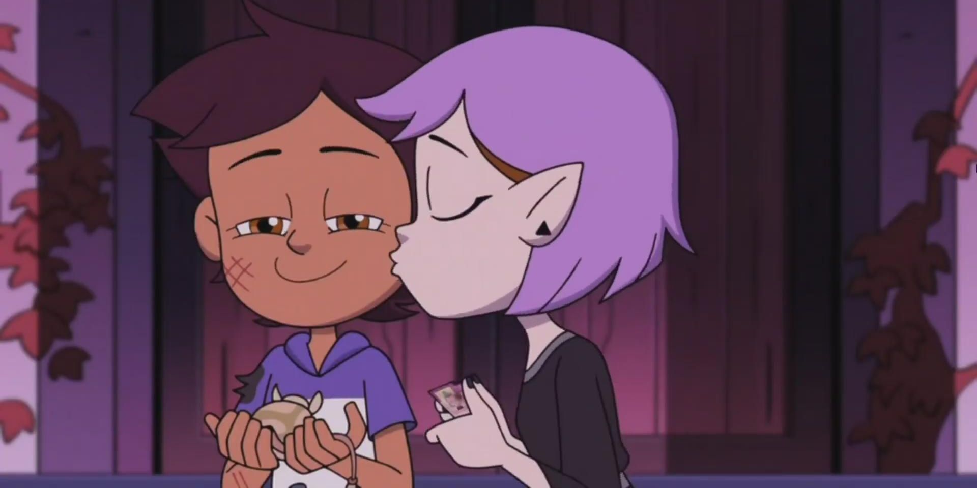 Image of Amity kissing Luz on the cheek in The Owl House