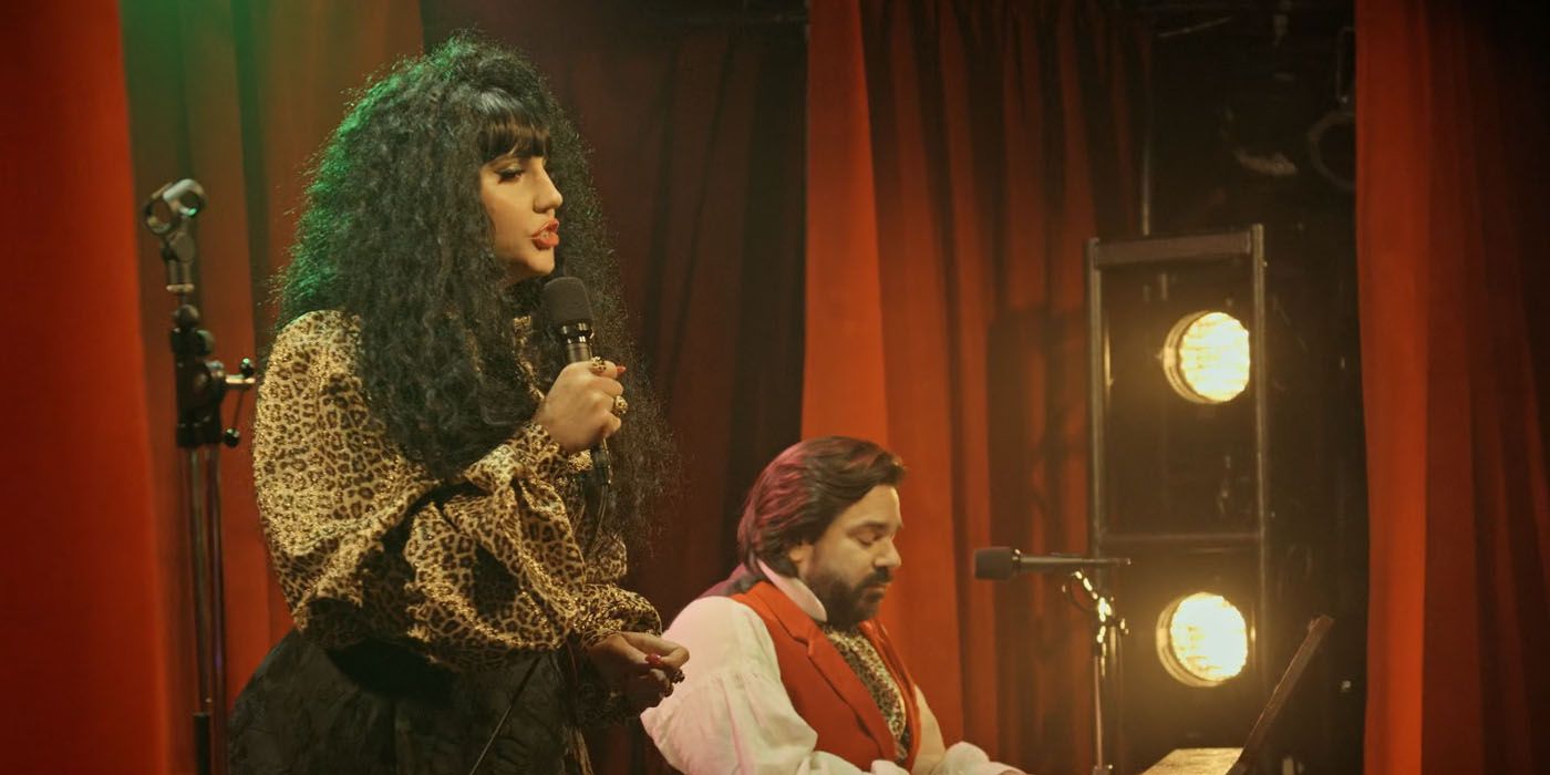 Nadja and Laszlo singing as a human music group in What We Do in the Shadows