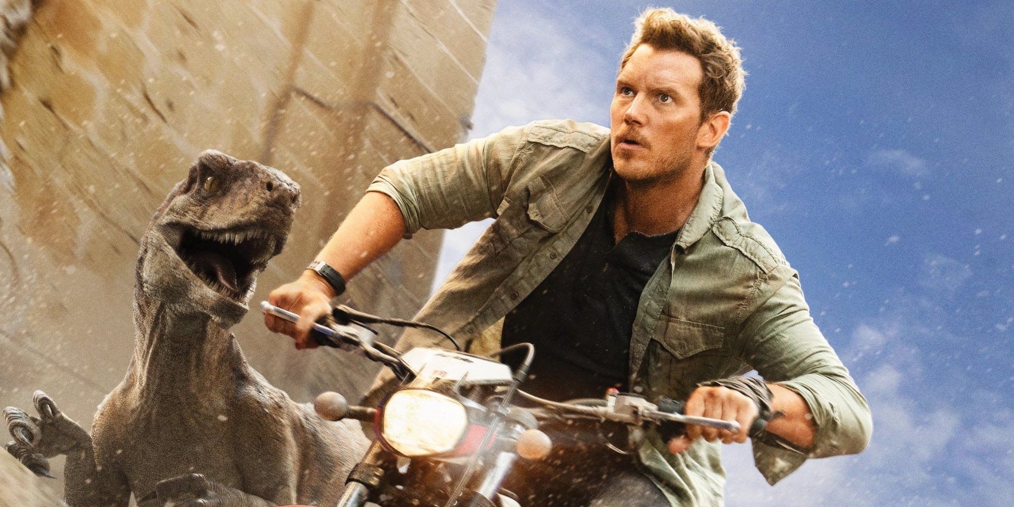 Owen Grady riding a bike and escaping from a raptor in Jurassic World Dominion