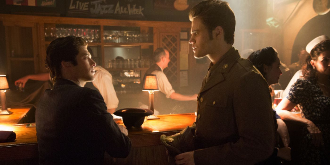Stefan and Damon talking at a bar during WWII in The Vampire Diaries.