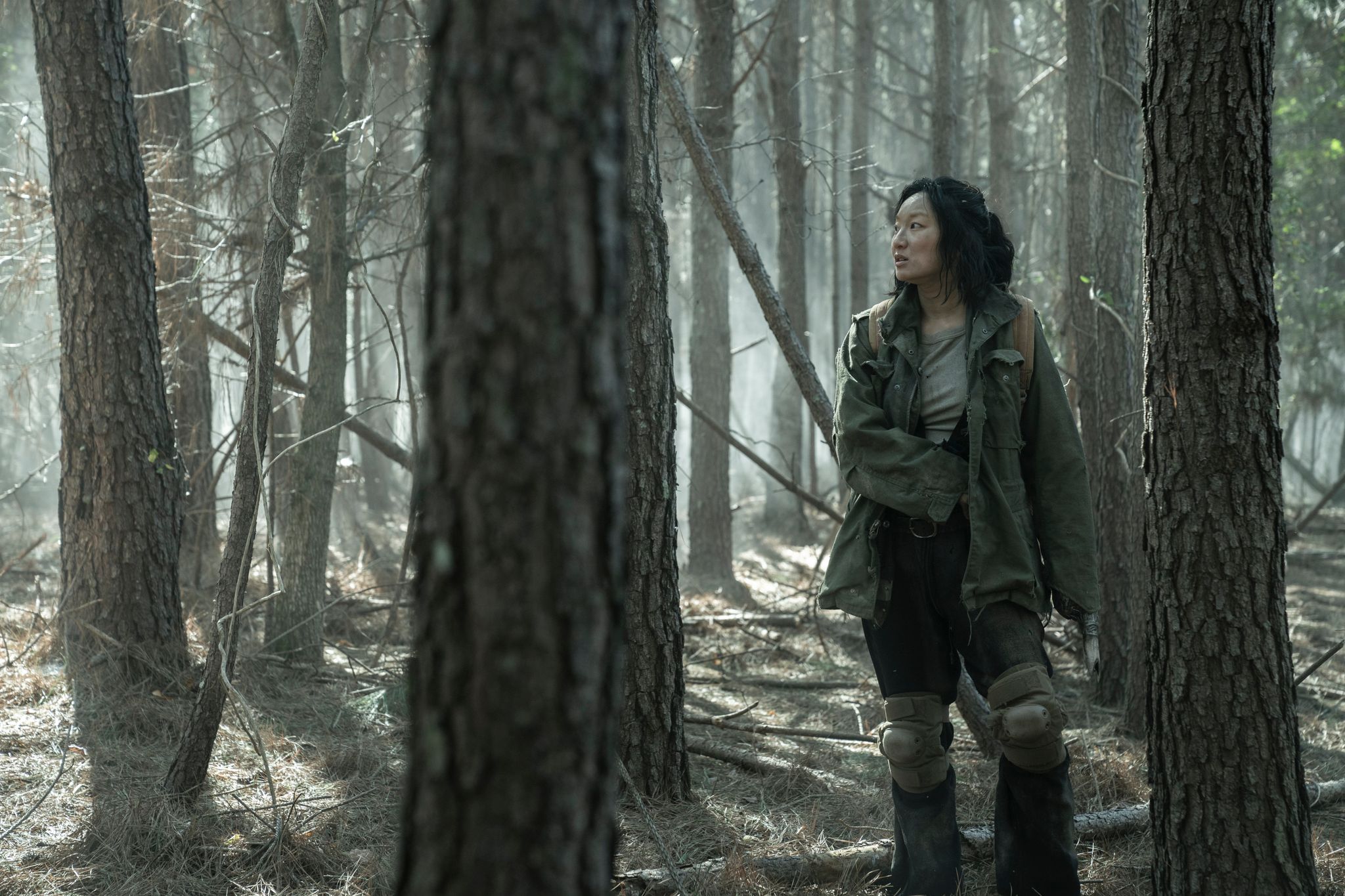 Poppy Liu in character as Amy in Tales of the Walking Dead in a snowy forest setting
