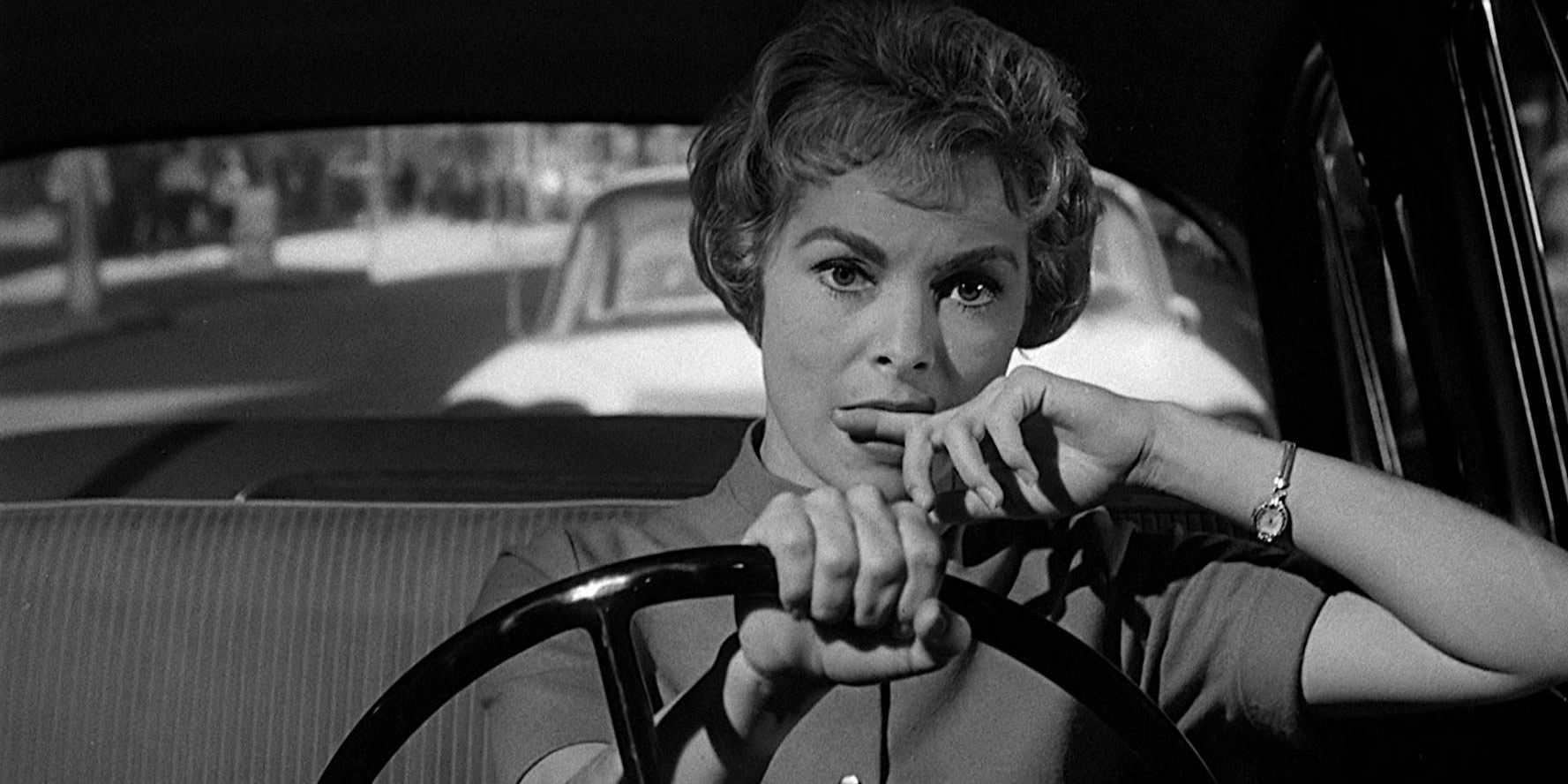 Marion biting her finger while driving.