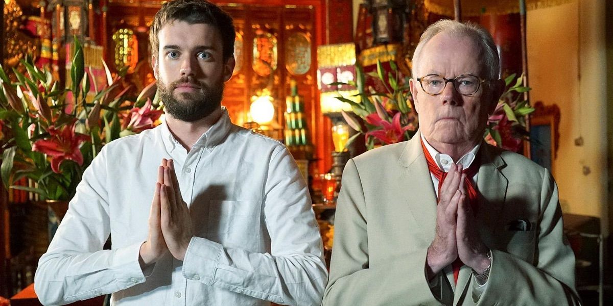 Jack Whitehall and his father pose in a prayer position from Travels with my father 