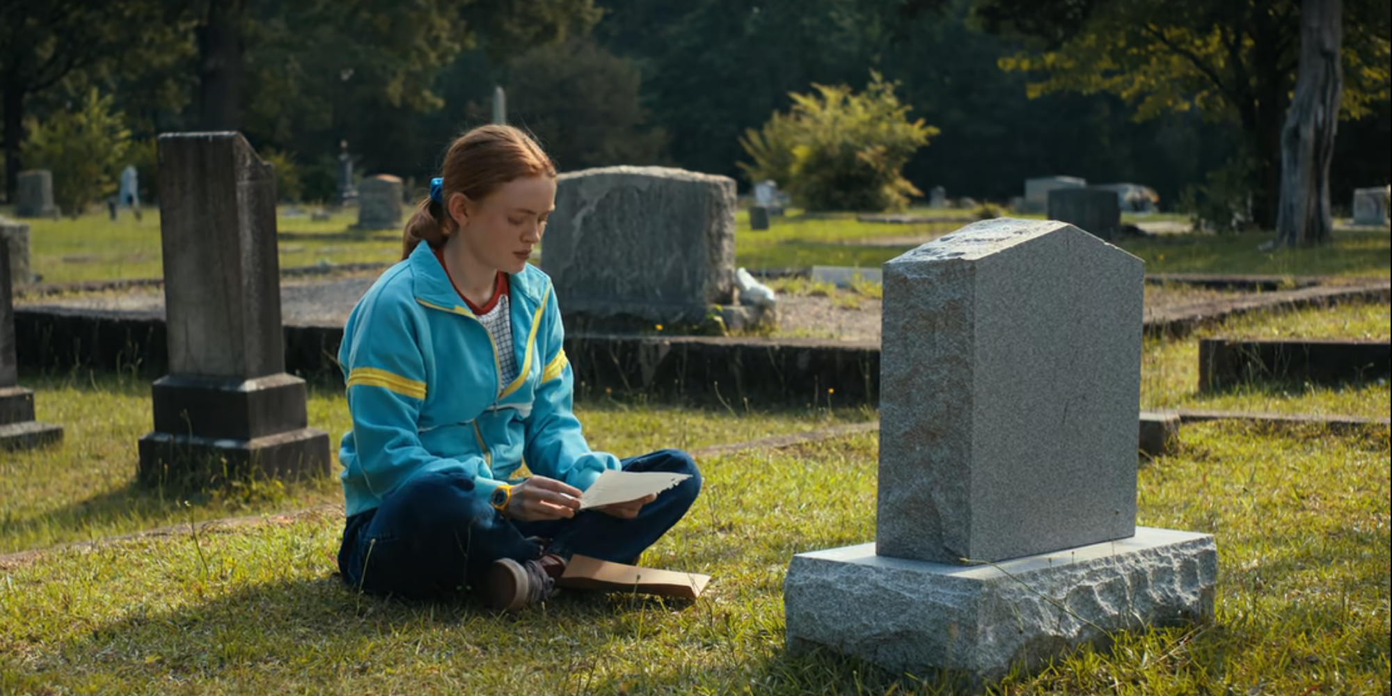 Max reads Billy a letter at his grave in Stranger Things season 4.