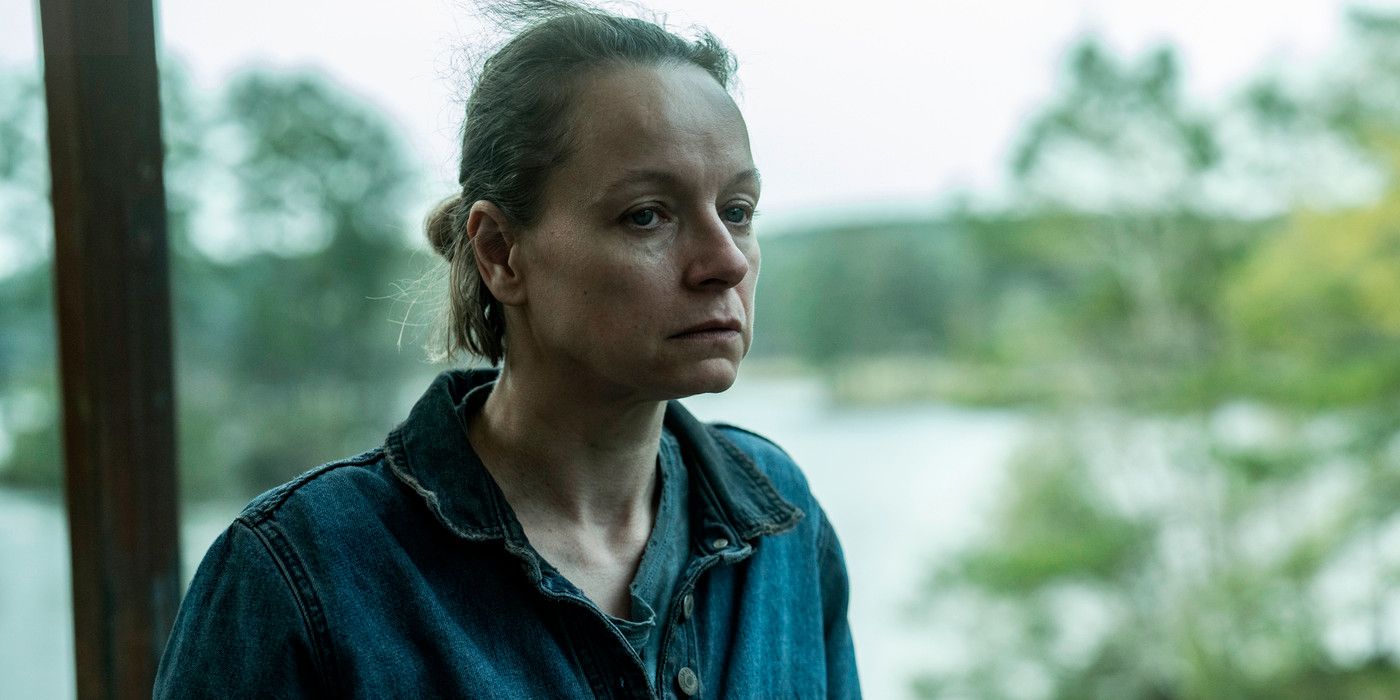 Samantha Morton in character as Alpha in Tales of the Walking Dead looking pensive by a lake