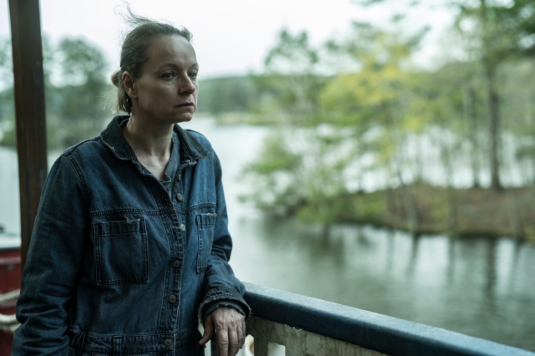 Samantha Morton in character as Alpha in Tales of the Walking Dead looking pensive beside a lake