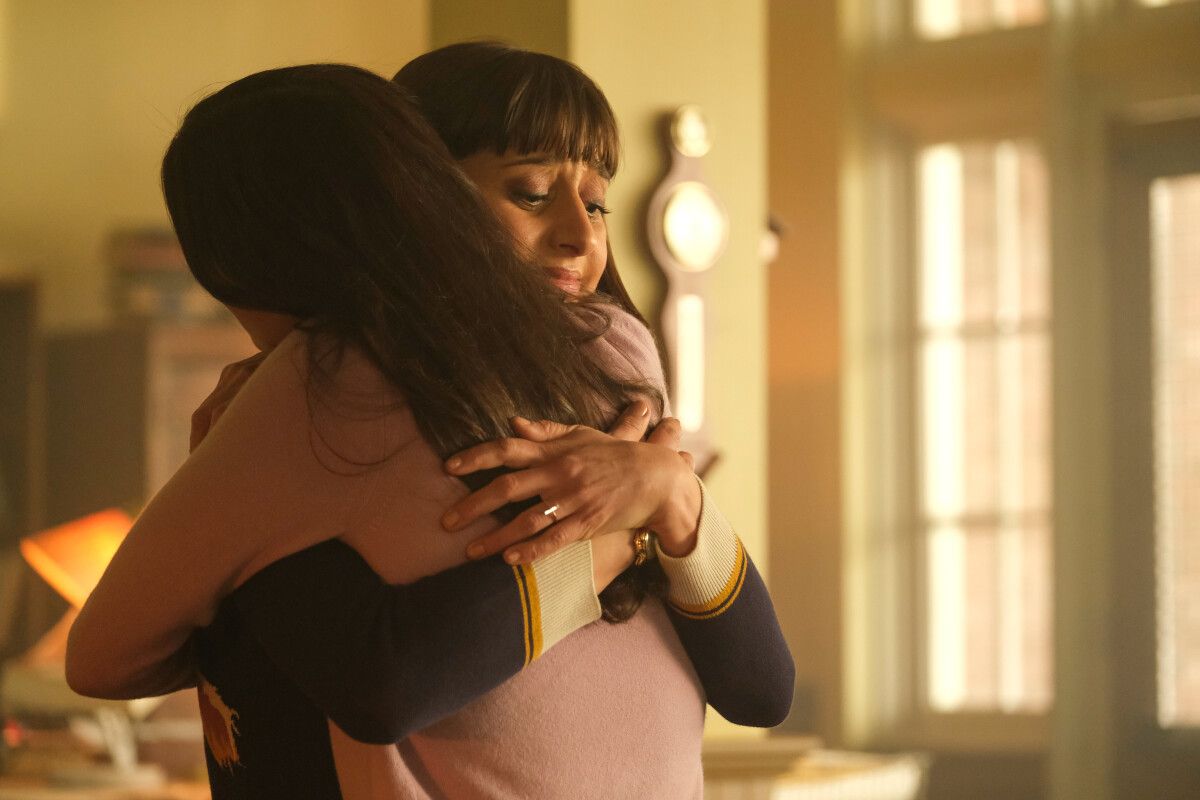 Sofia Hasmik as Chrissy Beppo hugging Bitsie Tulloch as Lois Lane in Superman and Lois season 2
