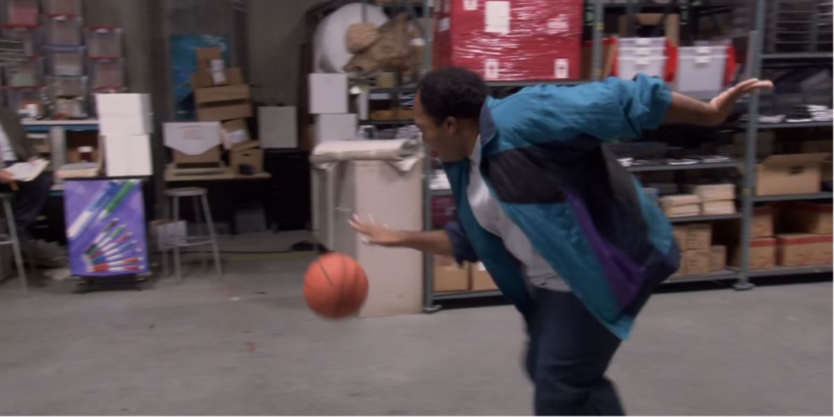 Stanley Hudson dribbling a basketball in The Office