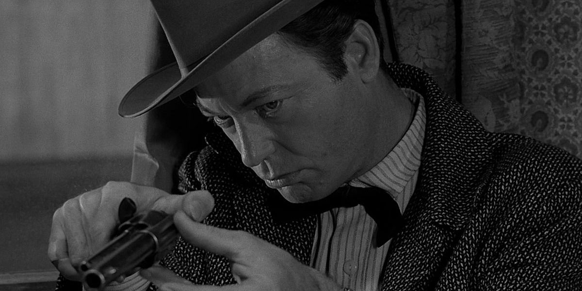 DeForest Kelley looks down the barrel of a pistol in Have Gun - Will Travel 