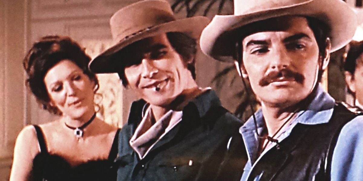 Majel Barrett looks on with two cowboys from Westworld