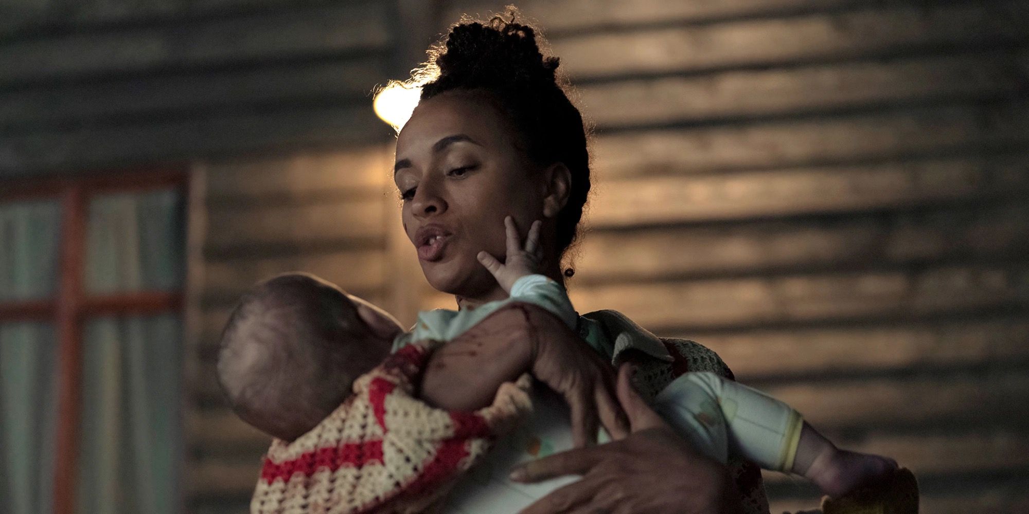 Image of Tash holding the baby in HBO Max’s The Baby