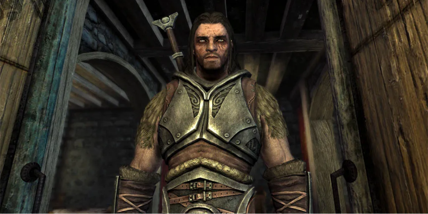 Skyrim's Farkas looking down on the player, clad in iron and fur armor and bearing a neutral expression.