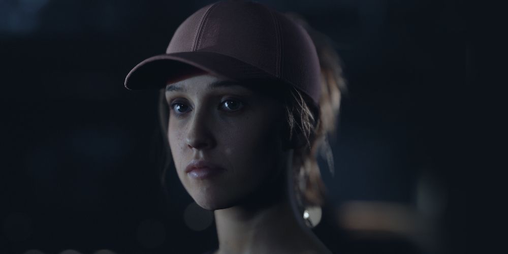 Laura wears a baseball cap in The Quarry
