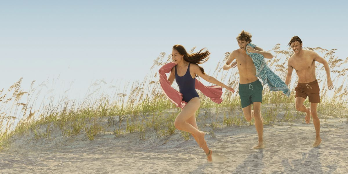 Belly, Jeremiah, and Conrad running to the ocean in The Summer I Turned Pretty