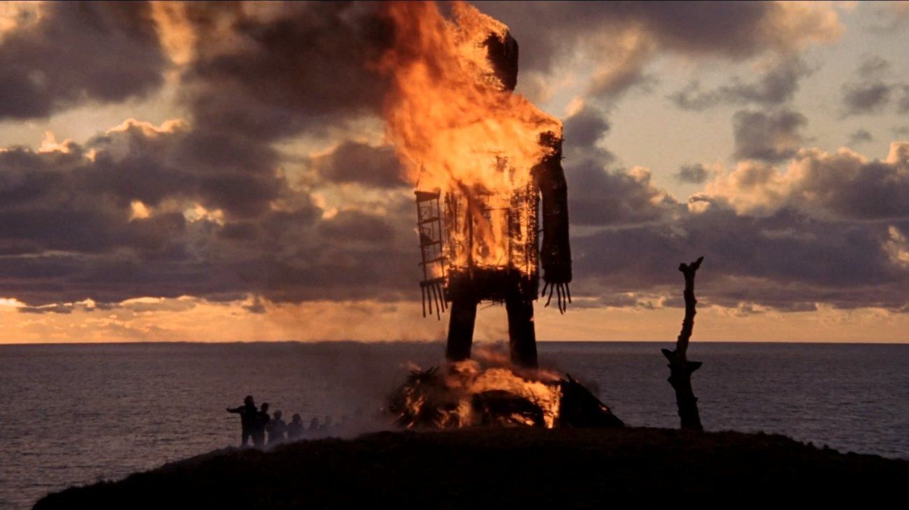 The Wicker Man burning as the sun sets