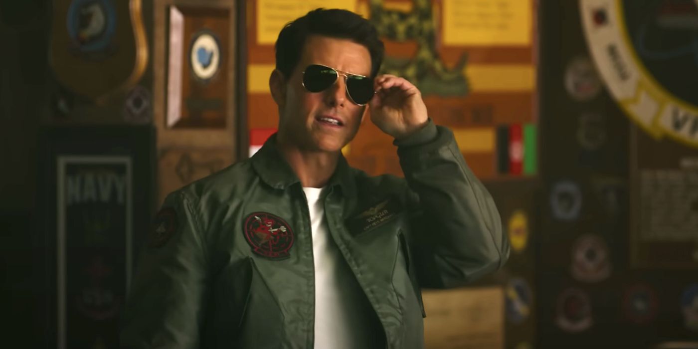 Tom Cruise about to remove his sunglasses in Top Gun: Maverick
