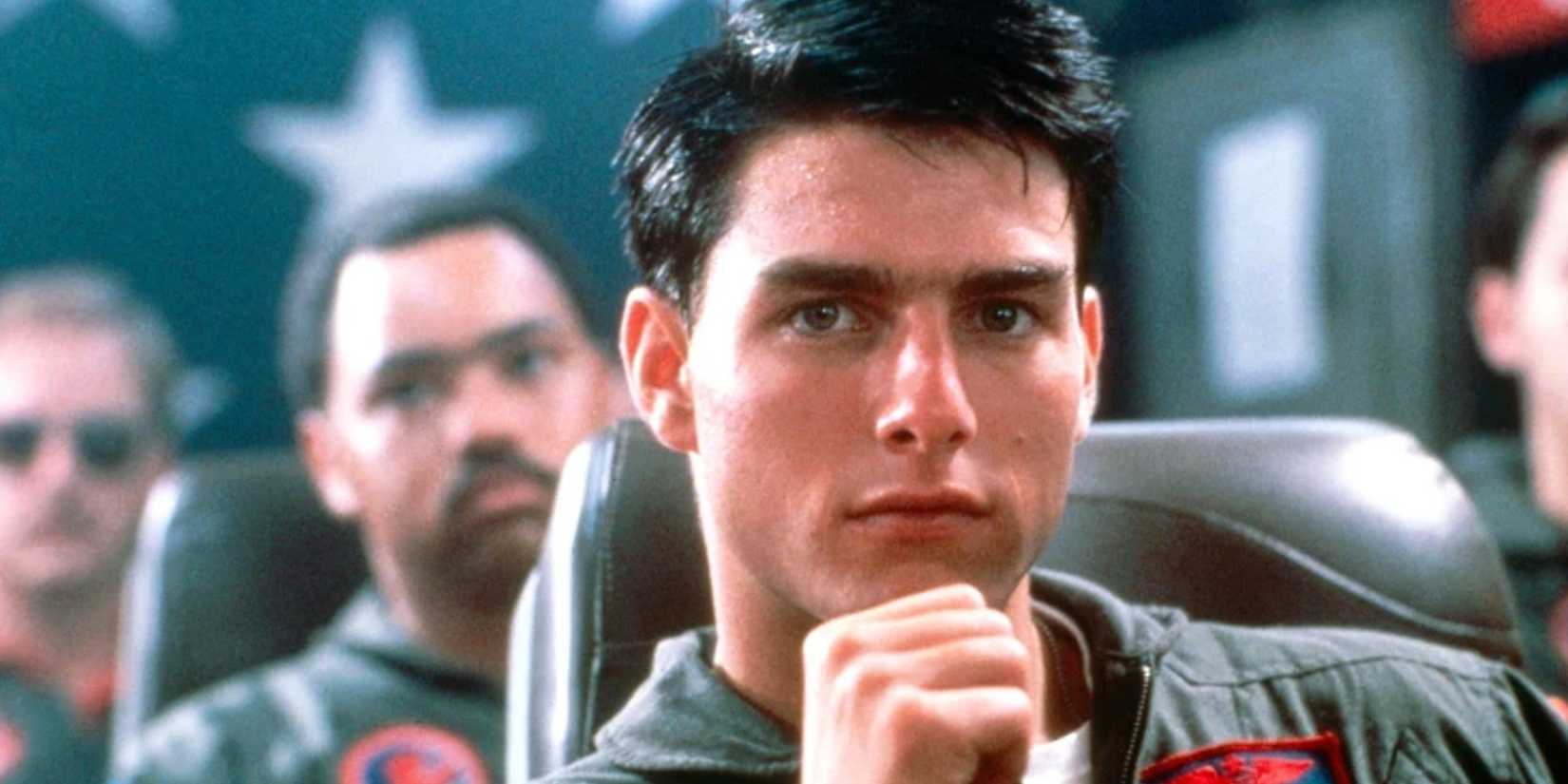 Tom Cruise as Maverick sitting in a classroom in Top Gun