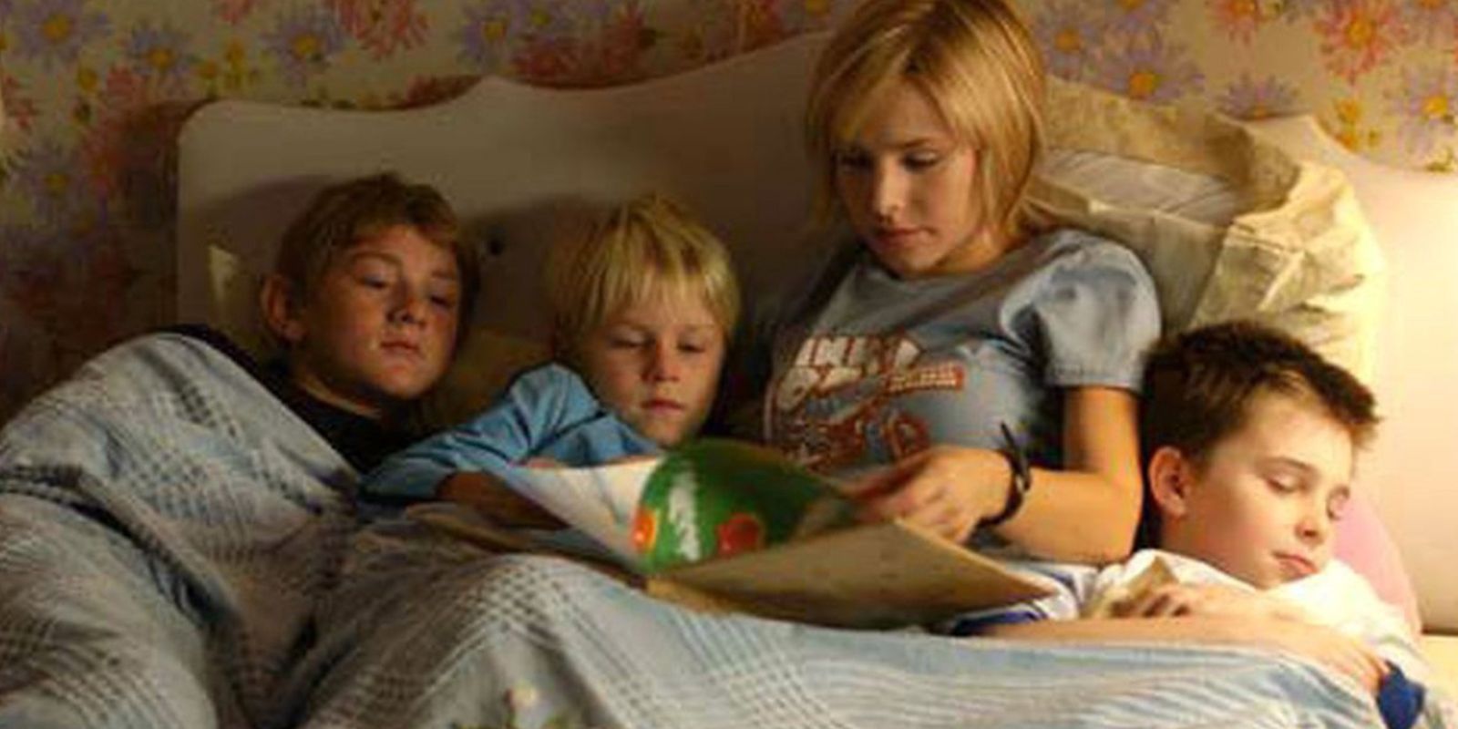 Gracie reading to her brothers in bed