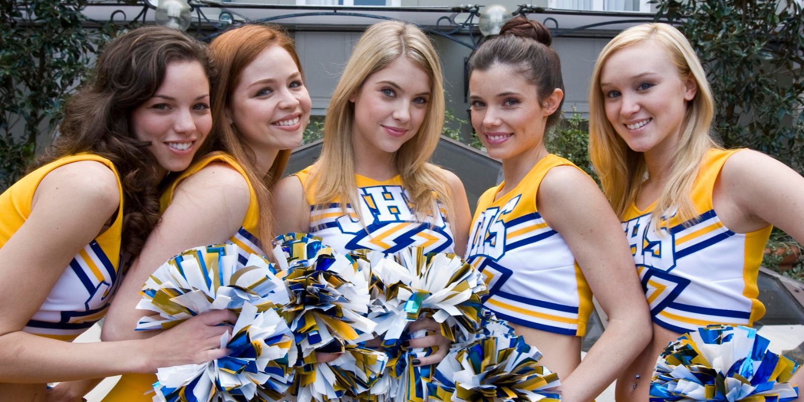 The Fab Five posing in cheer uniforms