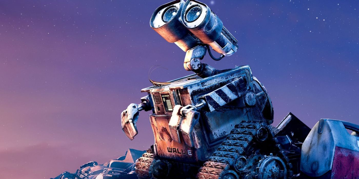 Wall-E standing on litter and staring up at the sky