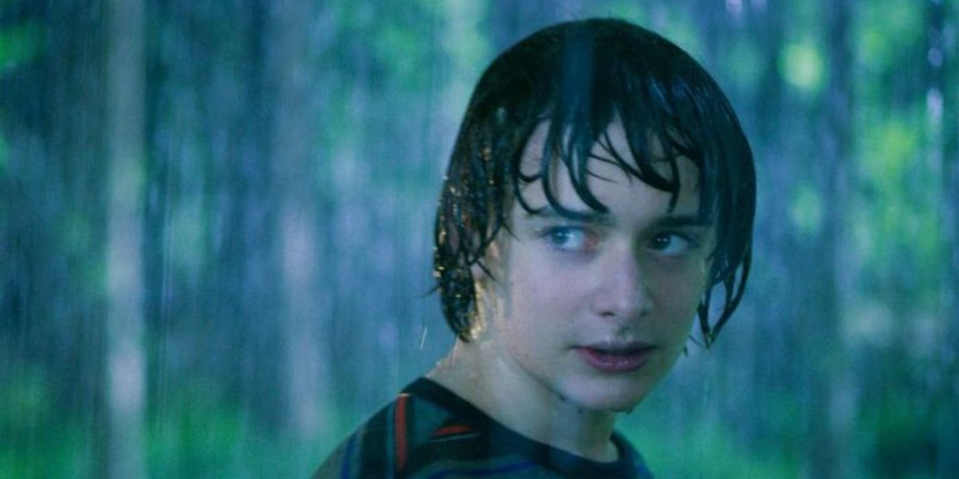 Will Byers in the rain, looking at his friends dramatically