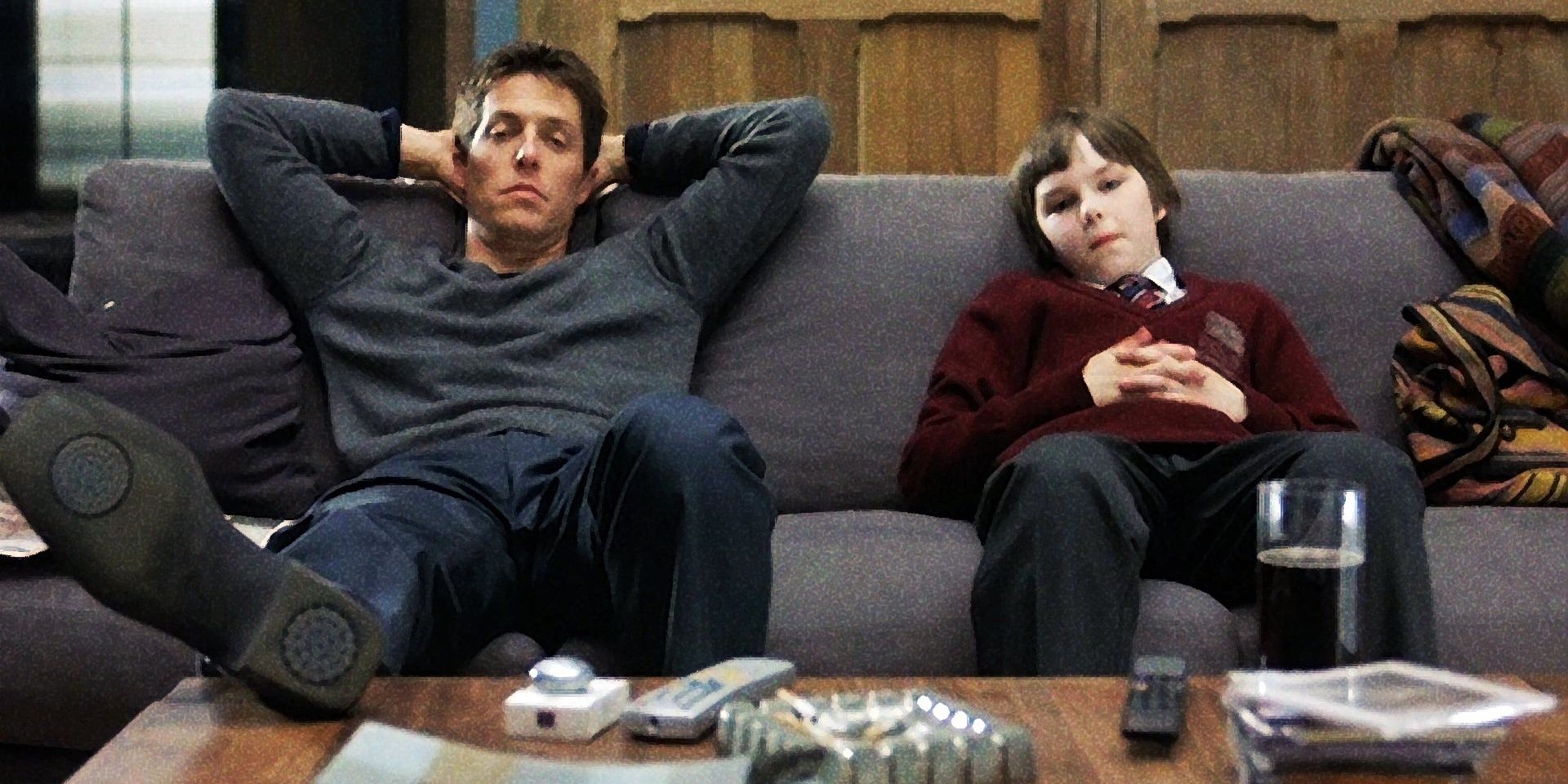 Will and Marcus sitting on a couch in About A Boy Cropped