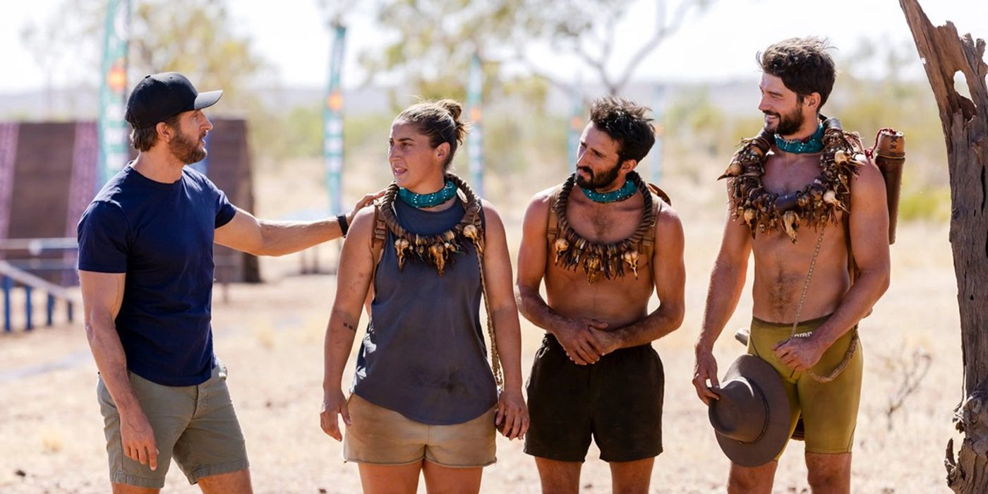 The host and three players from Australian Survivor standing on the island.
