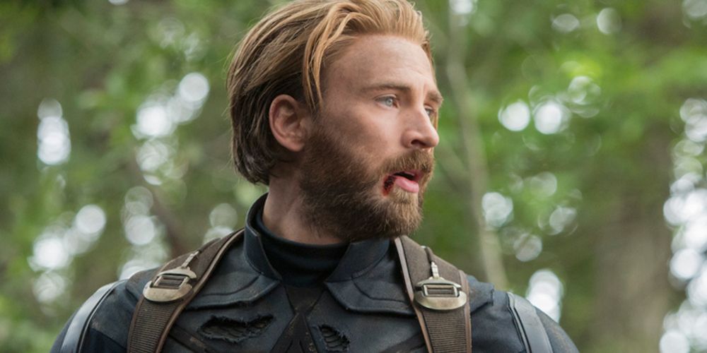 Steve stands in the woods with a bloody lip in Avengers: Infinity War