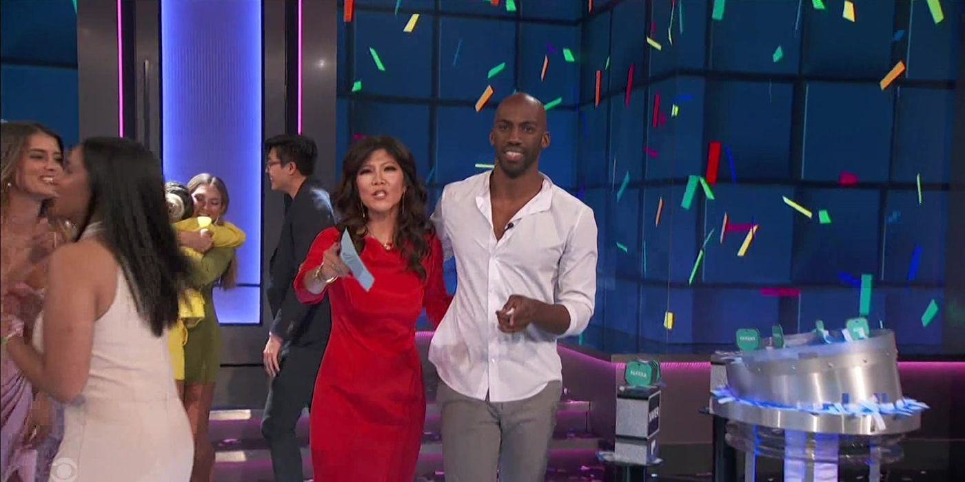 Xavier from Big Brother 23 posing with host Julie Chen after his win.