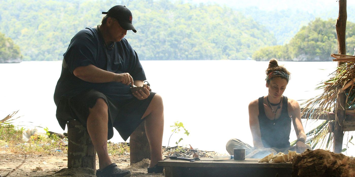 Two players from the reality show Castaways sitting outside.