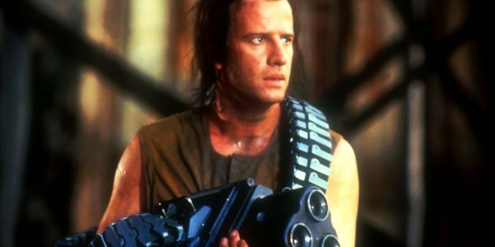 John holds a large gun in Fortress